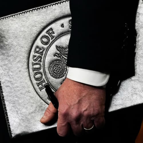 Speaker of the House Mike Johnson, R-La., holds a folder during a news conference on the Epstein Files Transparency Act, Tuesday, Nov. 18, 2025, at the U.S. Capitol in Washington. (AP Photo/Julia Demaree Nikhinson)