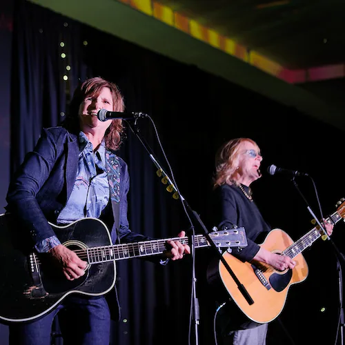 Amy Ray (left) and Emily Saliers, better known as Indigo Girls, first performed on the Decatur Square 40 years ago. They have returned to that stage many times over the years. (Courtesy WABE)