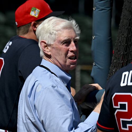 Braves chairman Terry McGuirk (center) — pictured chatting with first baseman Matt Olson during workouts in Florida earlier this month — and other team executives are seeking a new way to televise Braves games this season after the team parted ways with FanDuel Sports Network. (Hyosub Shin/AJC)