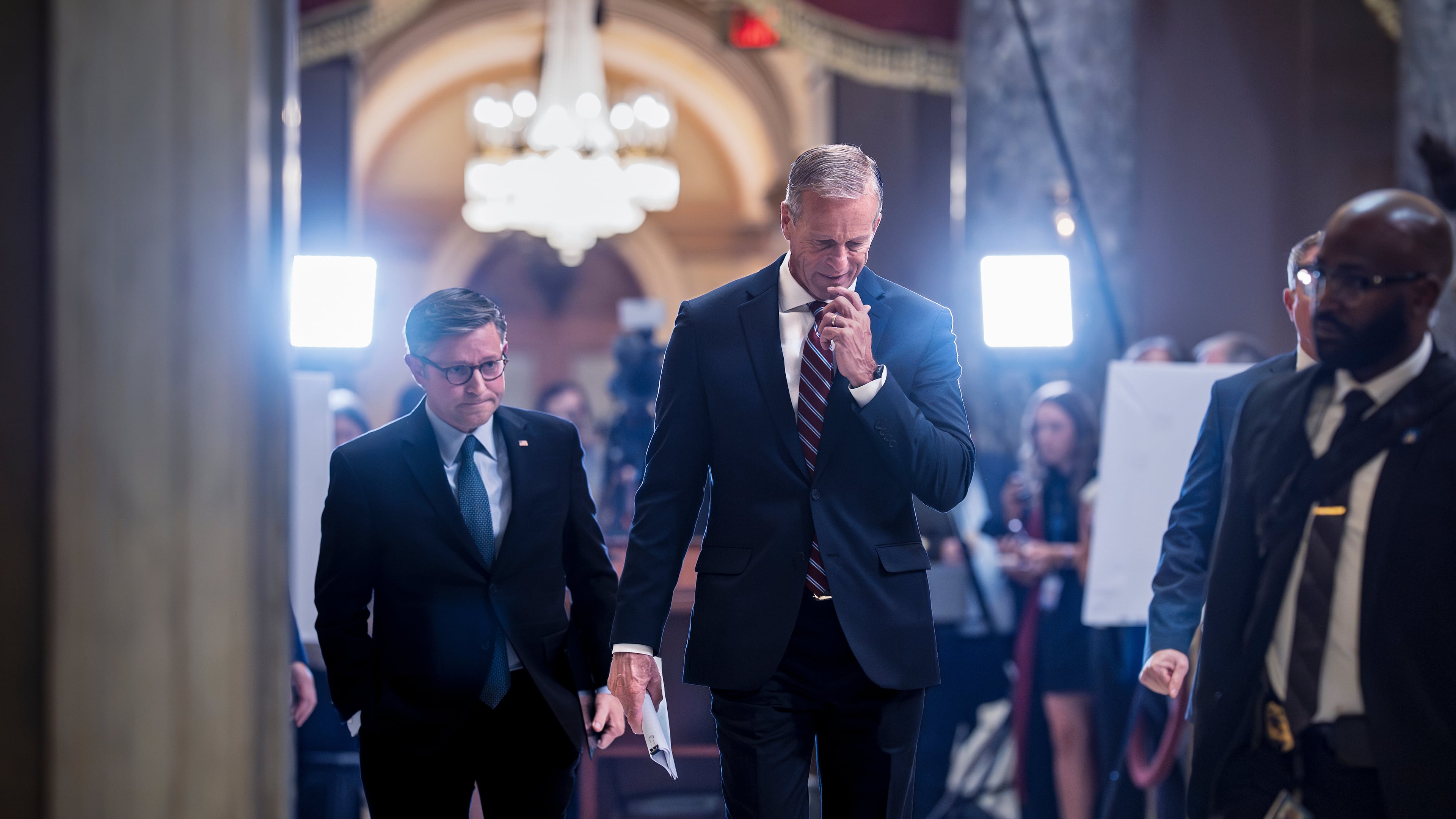 Speaker of the House Mike Johnson, R-La., left, and Senate Majority Leader John Thune, R-S.D., return to their offices after meeting with reporters on the third day of the government shutdown, at the Capitol in Washington, Friday, Oct. 3, 2025. (AP Photo/J. Scott Applewhite)