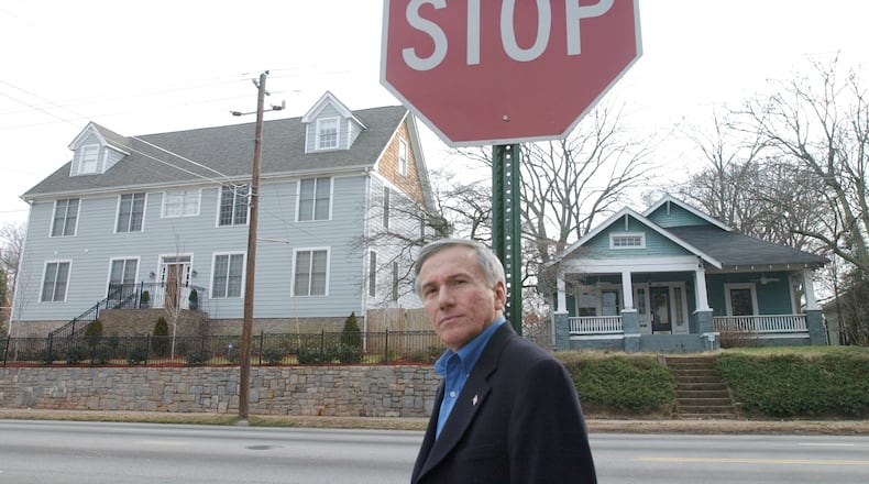Paul Zucca in Grant Park where a larger newly built house dwarfed a smaller historic Craftsman home. Zucca, a businessman, served on many city advisory committees, was active in local politics and a fighter for keeping Grant Park's historic homes intact. He helped the intown neighborhood gain a historic status that protects it many old homes. He died earlier this month. HW.A. BRIDGES JR./STAFFF)