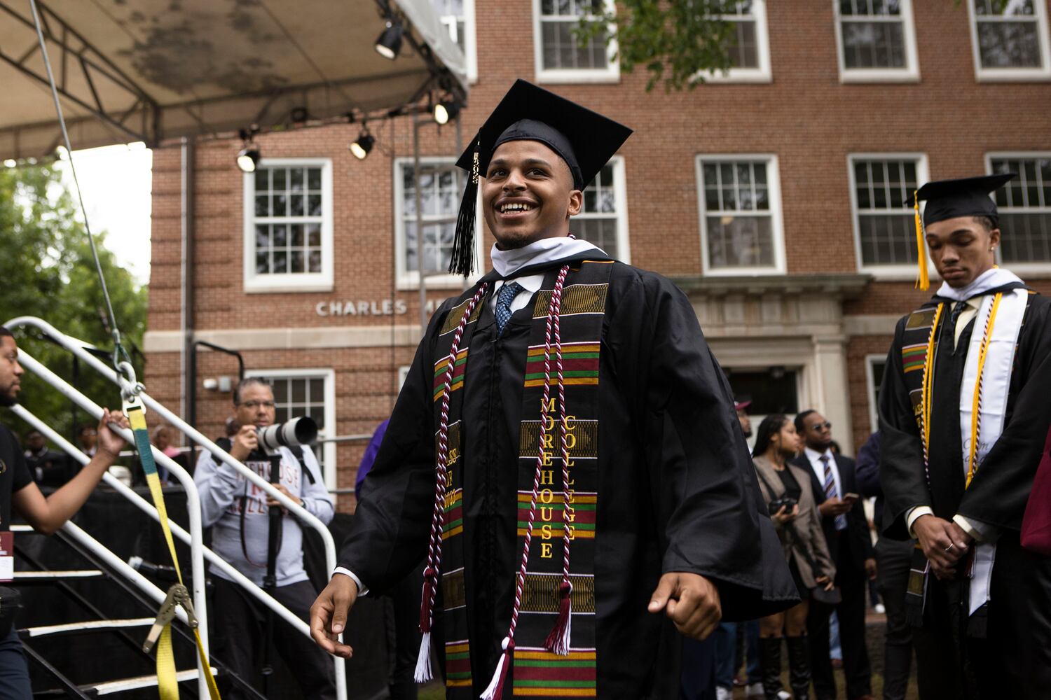 A Morehouse College graduate walks to receive his diploma during the Morehouse College commencement ceremony on Sunday, May 21, 2023, on Century Campus in Atlanta. The graduation marked Morehouse College's 139th commencement program. CHRISTINA MATACOTTA FOR THE ATLANTA JOURNAL-CONSTITUTION