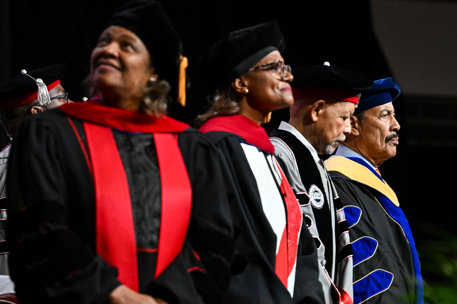Faculty members are seen on stage prior to the start of Clark Atlanta University’s 2025 commencement ceremony Sunday, May 18, 2025 at Georgia State’s Convocation Center. (Daniel Varnado/For the Atlanta Journal-Constitution)