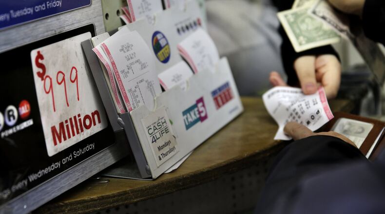 Elizabeth Johnson was trying to purchase tickets for Wednesday’s drawing but missed the cutoff by one minute. (AP Photo/Seth Wenig)