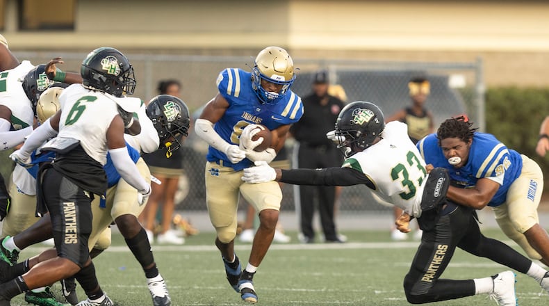 McEachern’s Jaylon Brown (8) runs the ball during a GHSA High School football game between Langston Hughes High School and McEachern High School at McEachern High School in Powder Springs, GA., on Friday, August 26, 2022. (Photo by Jenn Finch)