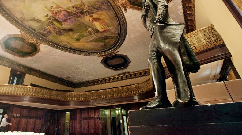 FILE - A statue of Thomas Jefferson, right, stands in New York's City Hall Council Chamber, July 14, 2010. (AP Photo/Richard Drew, File)
