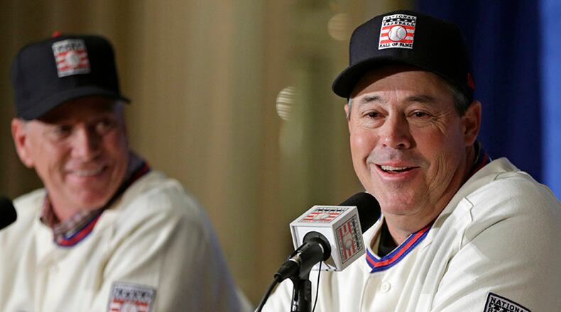 Former Braves pitcher Greg Maddux will enter the Hall of Fame along with Tom Glavine (background) and manager Bobby Cox.