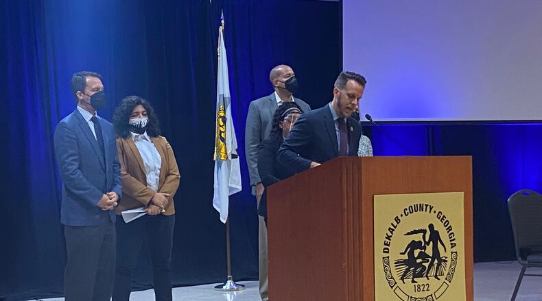 DeKalb Commissioner Ted Terry (center) introduced Tuesday local legislation that would mandate the safe storage of firearms. From left, Terry was joined by Atlanta City Council President-elect Doug Shipman, Atlanta City Council District 5 representative-election Liliana Bakhtiari, gun safety advocate Julvonnia McDowell, Atlanta school board chair Jason Esteves and state Sen. Elena Parent. TYLER ESTEP / TYLER.ESTEP@AJC.COM