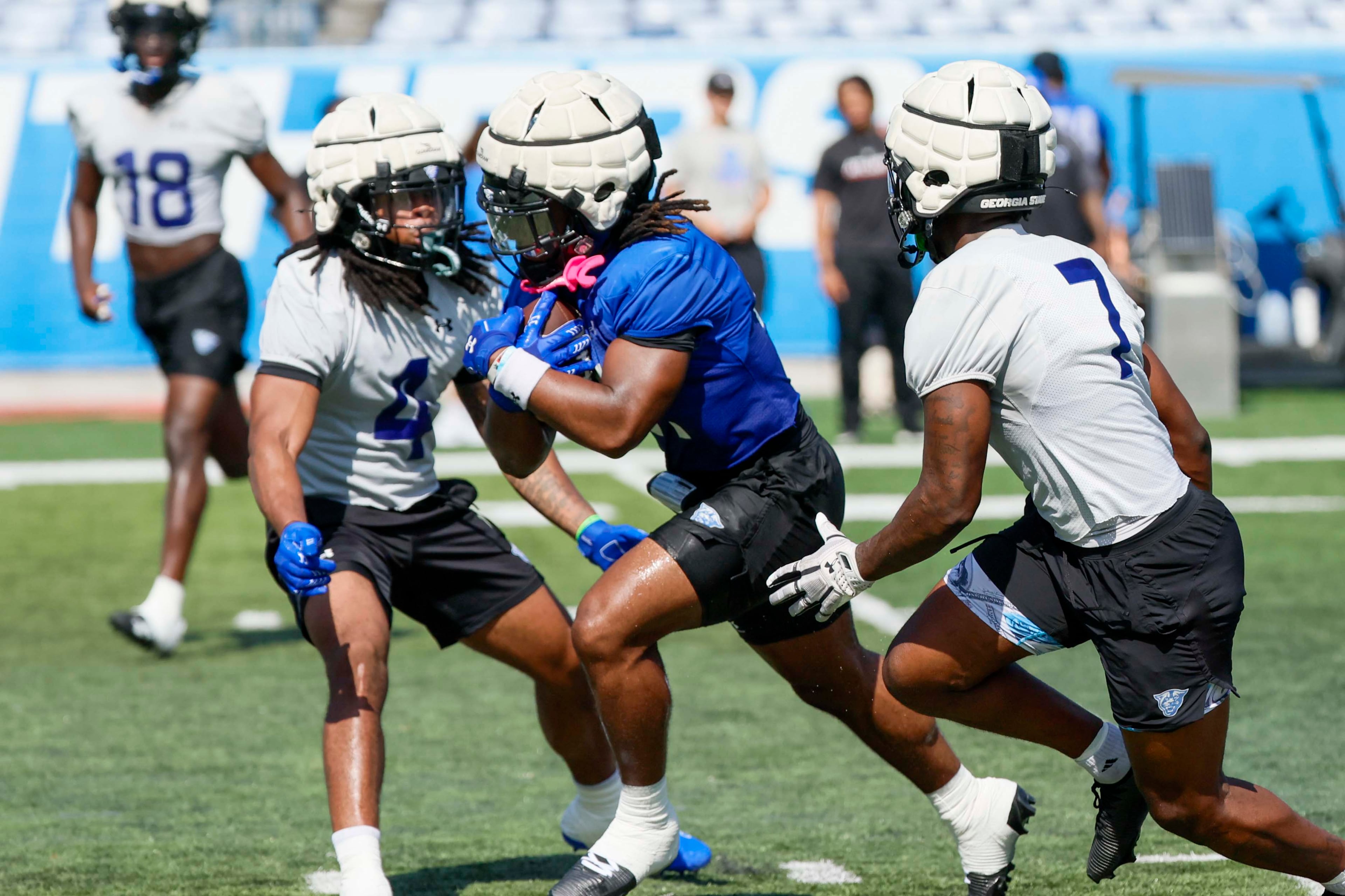 GSU TJ Peyton (21) runs through defenders during Georgia State University’s first day of practice at Center Parc Stadium on Thursday, July 31, 2025, in Atlanta.
(Miguel Martinez/ AJC)