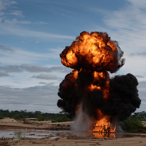 The Peruvian Navy destroys a dredge used for illegal mining near the Malinowski River in the Tambopata National Reserve in Puerto Maldonado, Peru, Tuesday, Aug. 11, 2026. (AP Photo/Guadalupe Pardo)