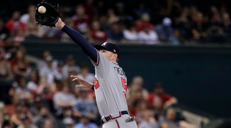 Braves third baseman Freddie Freeman robs Arizona Diamondbacks' A.J. Pollock of a hit during the fourth inning Monday, July 24, 2017, in Phoenix.