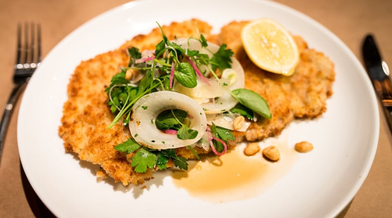 Chef Shaun Doty's pork schnitzel with onion salad, peanuts, Italian parsley. Photo credit- Mia Yakel.