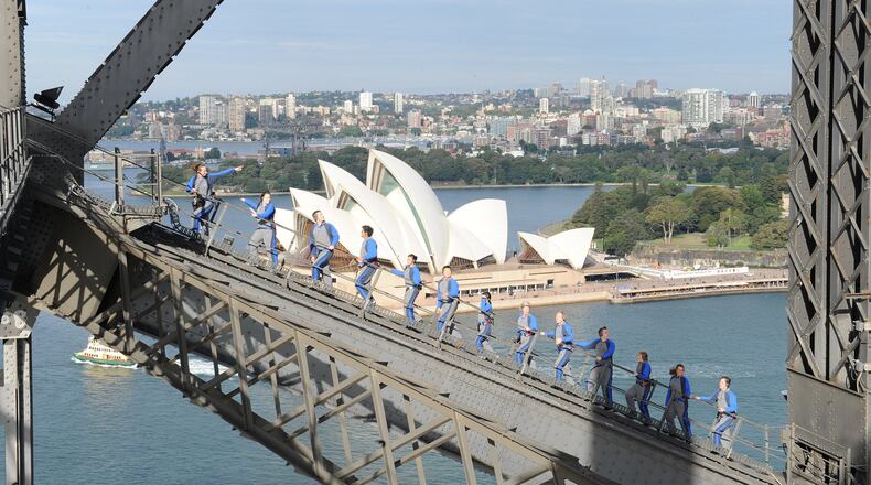 Scale the heights of Sydney’s Harbour Bridge, rising about a mile above the water and offering sweeping views of the city and its iconic landmark, the Sydney Opera House. Contributed by BridgeClimb Sydney