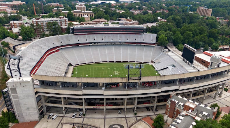 Aerial view of Sanford Stadium in Athens. With a $25 million expansion completed in 2003 and $8 million more in 2004, the University of Georgia added a second upper deck on the north side and 27 new north side SkySuites bringing the new stadium capacity to 92,746 — the fifth largest on-campus stadium in the country. UGA’s athletic department simply is committed to too many other facility projects that have precedence at the moment. Most notable is the $80 million football operations building that has been added to the Butts-Mehre complex. (Hyosub Shin / Hyosub.Shin@ajc.com)
