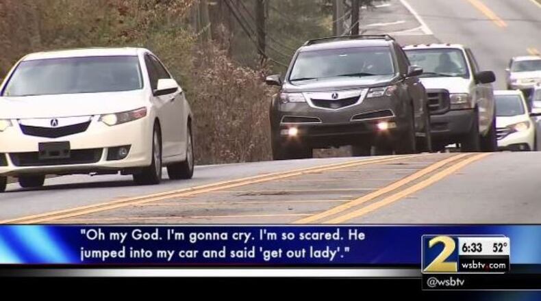 Police say a victim was stopped at a red light when she was attacked by a carjacker in Alpharetta.