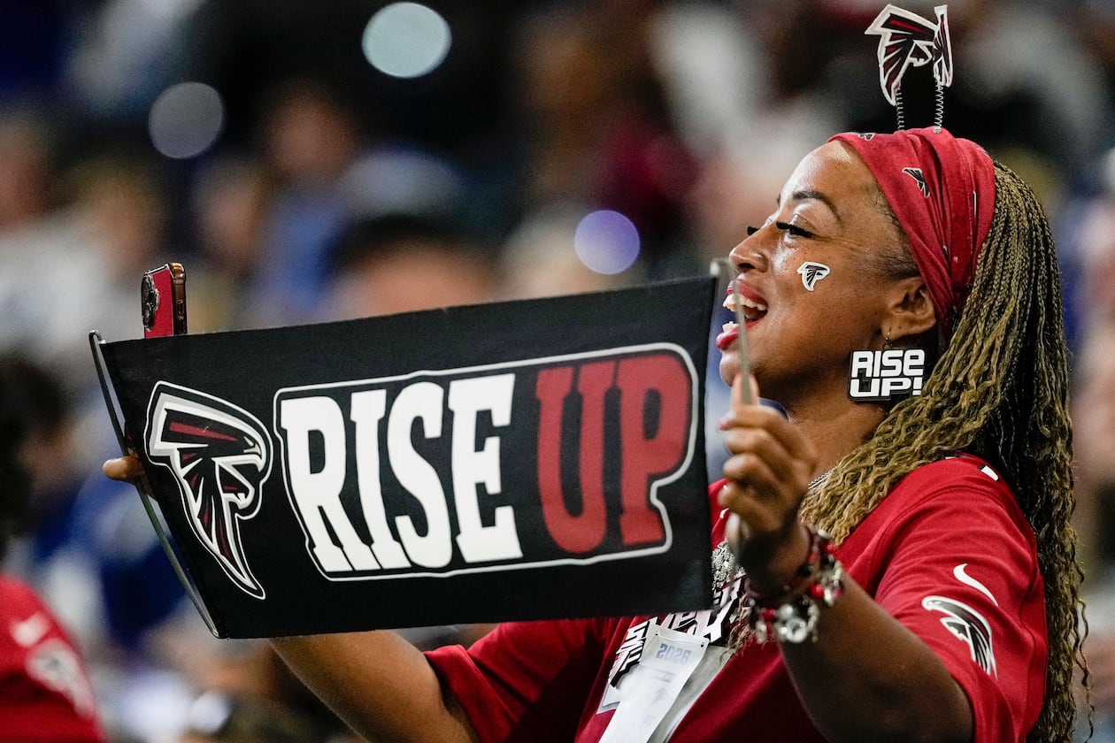 A Falcons fan cheers from the stands during the first half of an NFL exhibition game against the Colts on Saturday, Aug. 22, 2026, in Indianapolis. (Nam Y. Huh/AP)