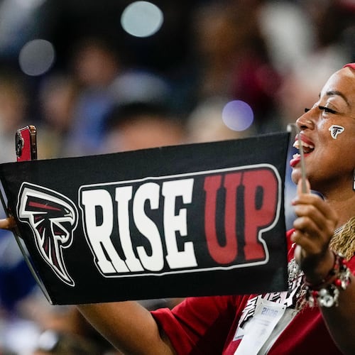 A Falcons fan cheers from the stands during the first half of an NFL exhibition game against the Colts on Saturday, Aug. 22, 2026, in Indianapolis. (Nam Y. Huh/AP)