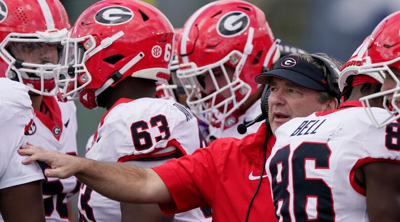 Georgia head coach Kirby Smart gives instruction to his players in the second half of an NCAA college football game against Vanderbilt, Saturday, Oct. 14, 2023, in Nashville, Tenn. (AP Photo/George Walker IV)