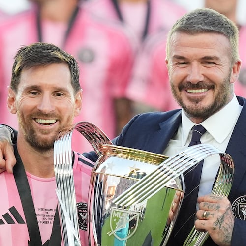 David Beckham poses with the MLS Cup trophy with Inter Miami forward Lionel Messi Saturday, Dec. 6, 2025, in Fort Lauderdale, Fla. (AP Photo/Rebecca Blackwell)