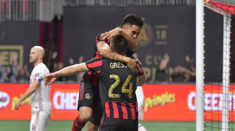 Atlanta United midfielder Gonzalo Martinez (10) celebrates with Atlanta United defender Julian Gressel (24) after Julian Gressel scored a goal in the first half during the Eastern Conference Final soccer match at Mercedes-Benz Stadium on Wednesday, October 30, 2019. (Hyosub Shin / Hyosub.Shin@ajc.com)