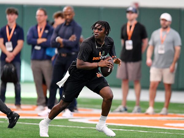 Miami quarterback Cam Ward runs a drill during the school's NFL football pro day Monday, March 24, 2025, in Coral Gables, Fla. (AP Photo/Michael Laughlin)