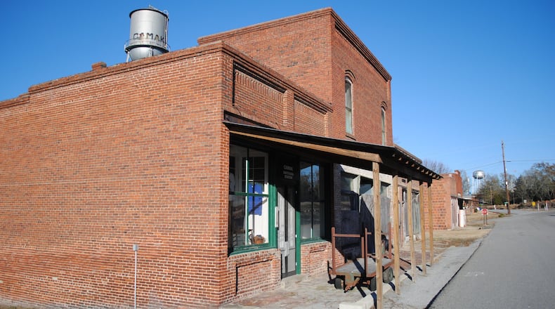 Camak, just off I-20 between Atlanta and Augusta, is among the small Georgia towns that have been steadily losing population. At one point in the 1950s, it had close to 300 residents. In the 2000 census, there were 165. In 2010, that number had dropped to 138, and last year, to 122. From 2010 to 2018, only five other towns in Georgia lost a greater proportion of their population than Camak. Today much of its former downtown sits abandoned. JENNIFER PEEBLES/jennifer.peebles@ajc.com