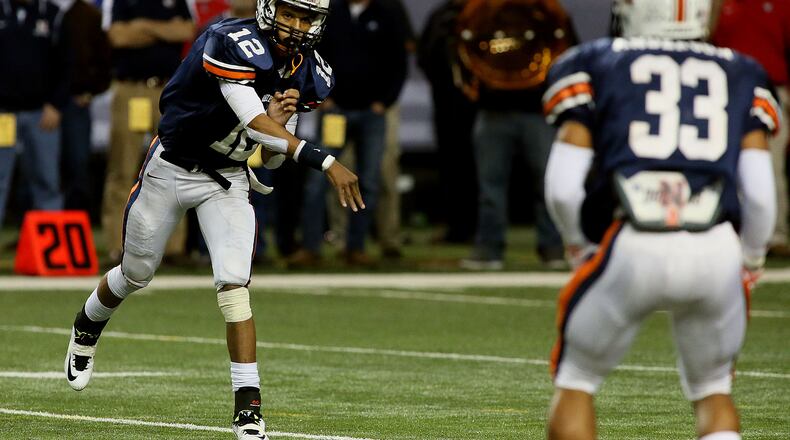 Northside-Warner Robins quarterback #12 Tobias Oliver throws to #33 T.J. Anderson in the first half action against Mays in their Georgia High School Association AAAAA Football state championship game at the Georgia Dome on Friday December 12th, 2014. (Photo by Phil Skinner)