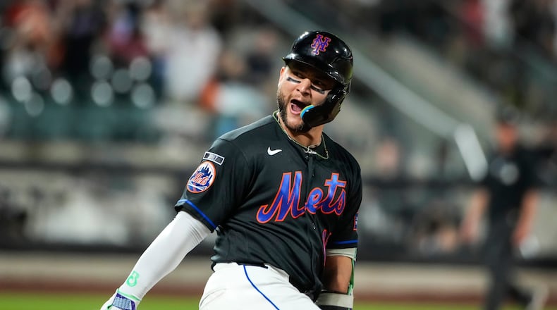 New York Mets' Bo Bichette (19) celebrates a solo home run during the second inning of a baseball game against the Atlanta Braves, Friday, June 12, 2026, in New York. (AP Photo/Eduardo Munoz Alvarez)