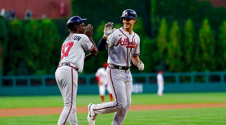 Matt Olson of the Braves, right, celebrates with third base coach Ron Washington after hitting a home run against Philadelphia Phillies pitcher Zack Wheeler during the first inning, Tuesday, June 28, 2022, in Philadelphia. (AP Photo/Matt Slocum)
