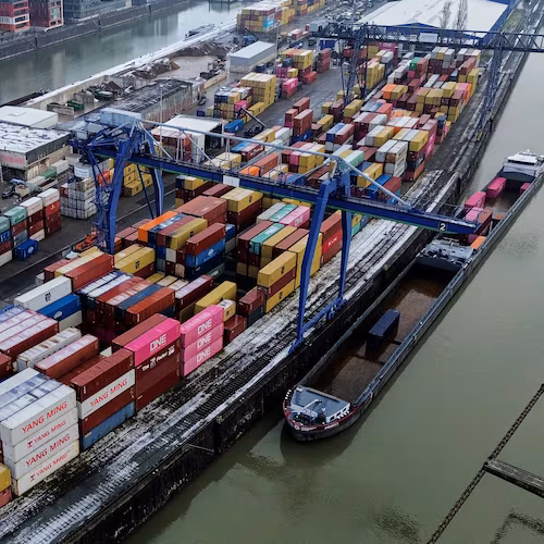 Containers are piled up in Frankfurt, Germany, Friday, Jan. 30, 2026. (AP Photo/Michael Probst)