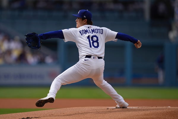 Los Angeles Dodgers starting pitcher Yoshinobu Yamamoto throws to the plate during the first inning of a baseball game against the New York Yankees, Sunday, June 1, 2025, in Los Angeles. (AP Photo/Mark J. Terrill)