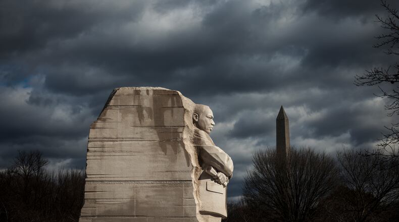 A statue of the Rev. Martin Luther King Jr. looks out over the National Mall in Washington, D.C. Born in Atlanta’s Sweet Auburn community, King emerged in 1955 as a drum major for democracy. (Oliver Contreras for The New York Times 2022)