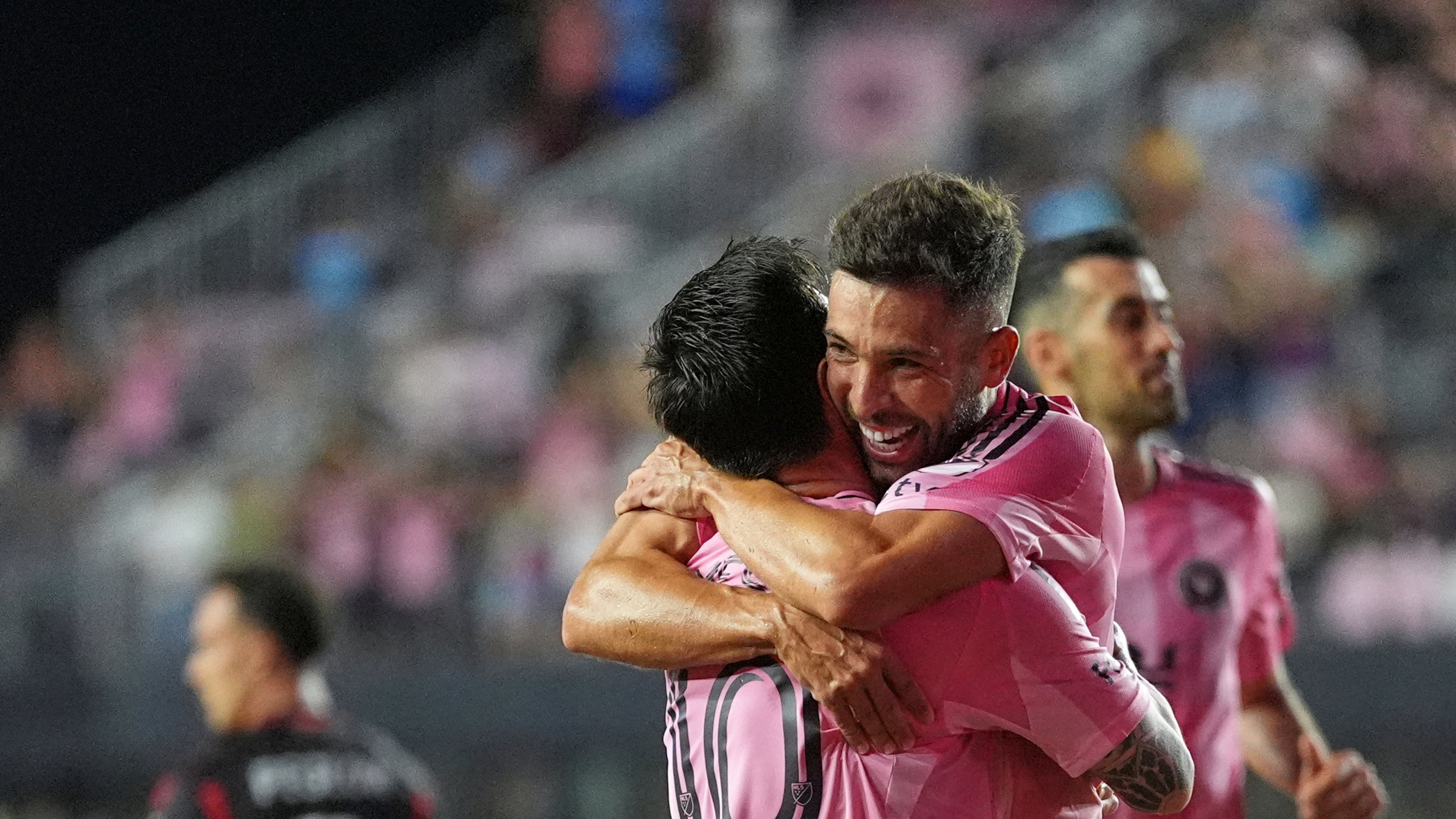 Inter Miami forward Lionel Messi (10) lifts defender Jordi Alba as he celebrates scoring his side's second goal against D.C. United during the second half of an MLS soccer match, Saturday, Sept. 20, 2025, in Fort Lauderdale, Fla. (AP Photo/Rebecca Blackwell)