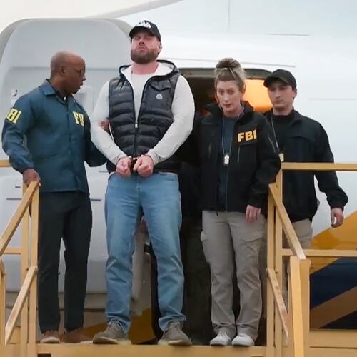 This still photo taken from video and provided by the FBI shows Ryan Wedding a former Canadian Olympic snowboarder facing charges related to drug trafficking and the killing of a federal witness is taken off a plane at Ontario International Airport in Ontario, Calif. on Friday, Jan. 23, 2026. (FBI via AP)