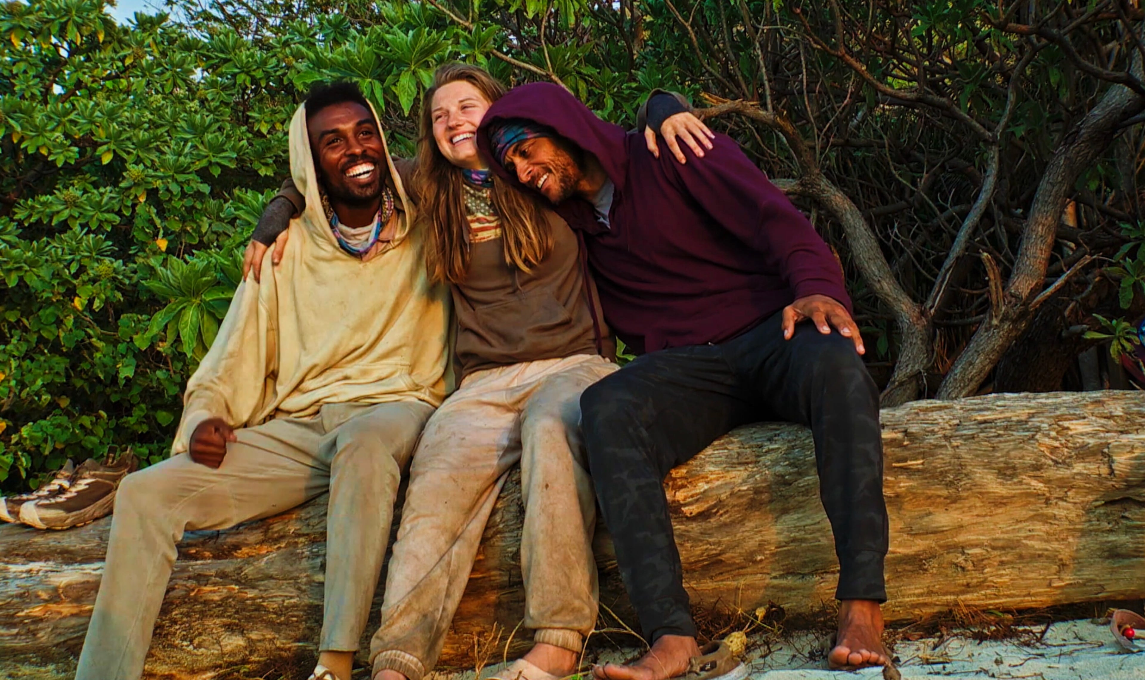 Kyle Fraser (from left), Eva Erickson and Joe Hunter share a group hug after becoming the final three during Season 48 of "Survivor." (CBS)