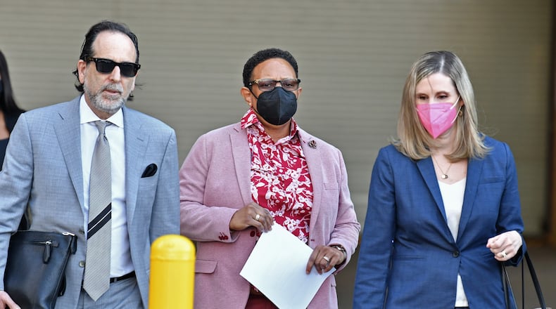 March 3, 2022 Atlanta - Mitzi Bickers, who served as Mayor Kasim Reed’s director of human services, leaves with her attorney, Drew Findling (left), after her hearing in federal court at the Richard B. Russell Federal Building on Thursday, March 3, 2022. Bickers is set to be the first person to face a jury in the Atlanta City Hall corruption investigation. She faces 12 counts related to an alleged conspiracy involving pay-to-play contracting. (Hyosub Shin / Hyosub.Shin@ajc.com)