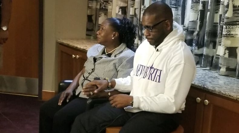 Dorothy Malcome and the Rev. Jamal Harrison Bryant, senior pastor of New Birth Missionary Baptist Church. Malcome had $3,000 in medical debt eliminated. CONTRIBUTED