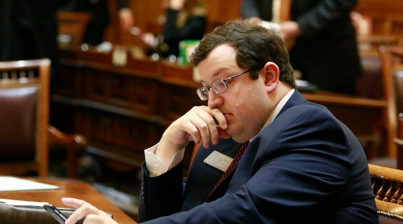 State Sen. Josh McKoon, R-Columbus, at his desk on the floor in 2016. Bob Andres, bandres@ajc.com