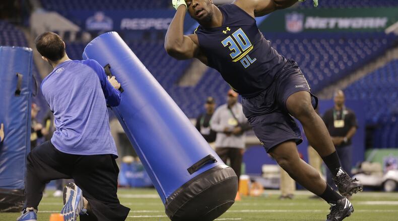 Michigan State defensive end Malik McDowell runs a drill at the NFL football scouting combine in Indianapolis, Sunday, March 5, 2017. (AP Photo/Michael Conroy)