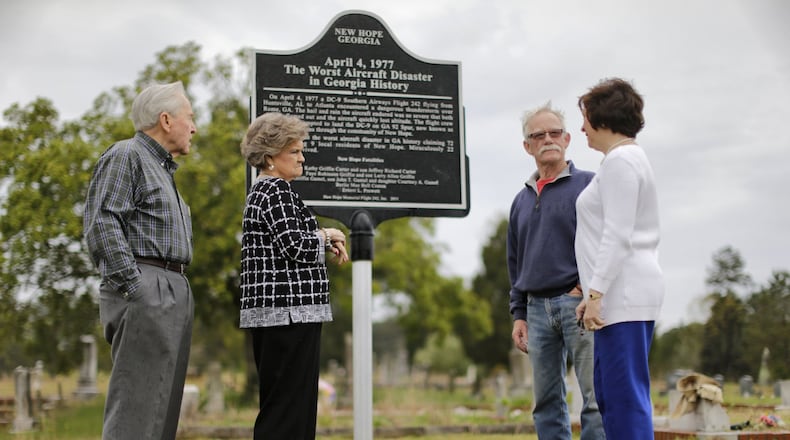 New Hope Memorial Flight 242 board members Loran Wills (from left), Peggy Wills, Hugh Walters and Cherry Waddell are at the site of the current marker. On April 4, 1977, Southern Airways Flight 242 crashed in Paulding County, killing more than 70 people. A nonprofit organization, New Hope Memorial Flight 242, plans a memorial. Currently there is a marker not far from the spot where the plane, coming from Alabama, crashed through pine trees and burst apart in flames. BOB ANDRES / BANDRES@AJC.COM