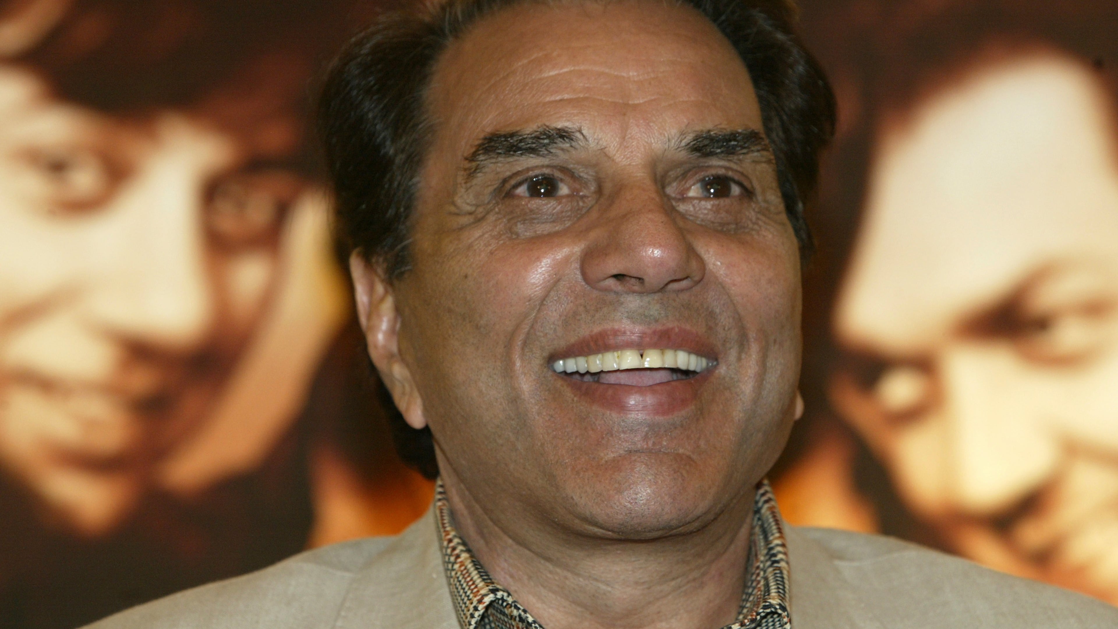 FILE - Bollywood actor and Indian lawmaker Dharmendra reacts during a promotional press conference of his latest film "Apne" in Calcutta, India, Monday, June 25, 2007. (AP Photo/Bikas Das, File)