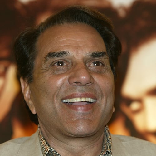 FILE - Bollywood actor and Indian lawmaker Dharmendra reacts during a promotional press conference of his latest film "Apne" in Calcutta, India, Monday, June 25, 2007. (AP Photo/Bikas Das, File)