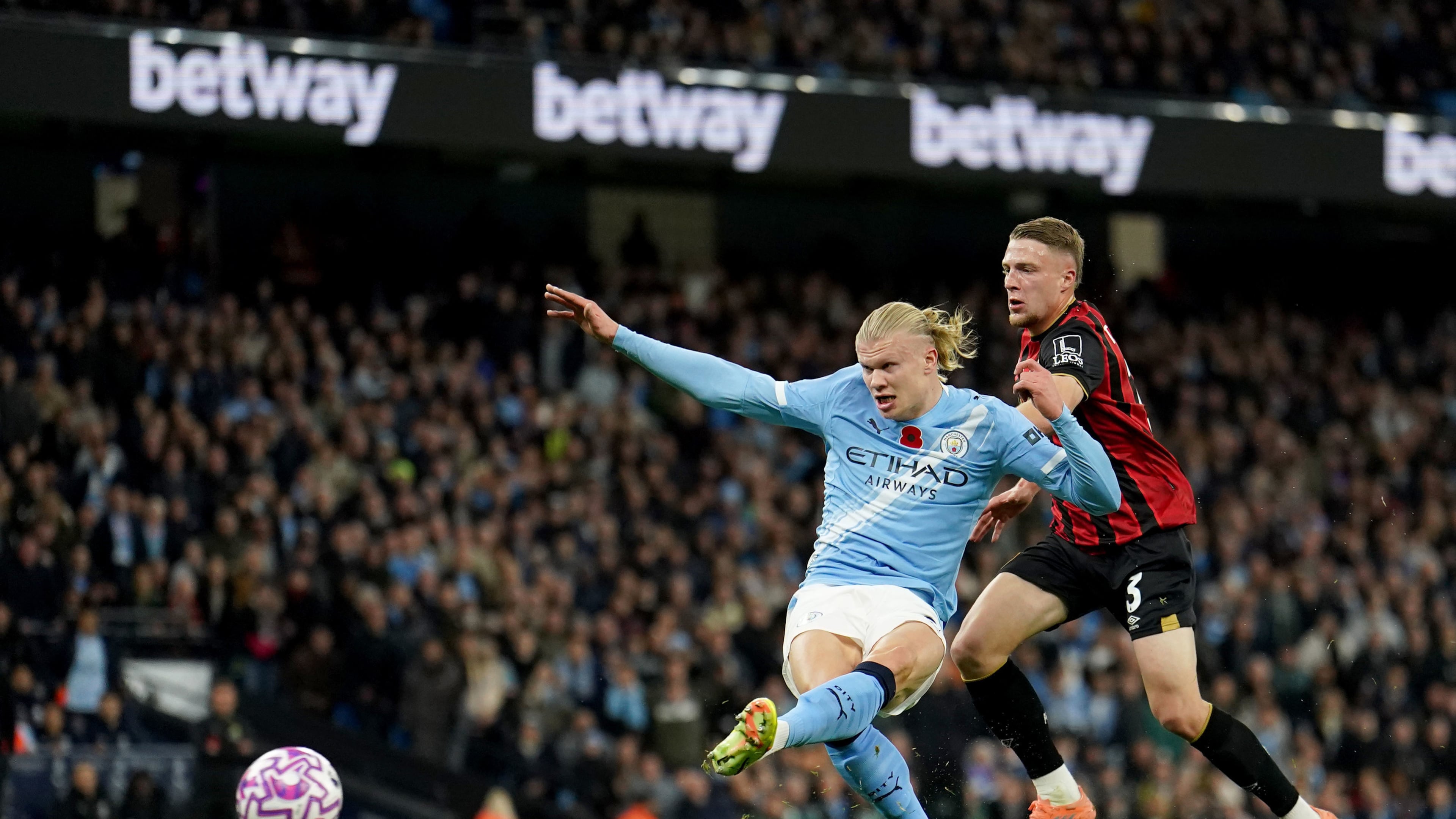 Manchester City's Erling Haaland scores his sides first goal during the English Premier League soccer match between Manchester City and Bournemouth in Manchester, England, Sunday, Nov. 2, 2025. (Martin Rickett/PA via AP)