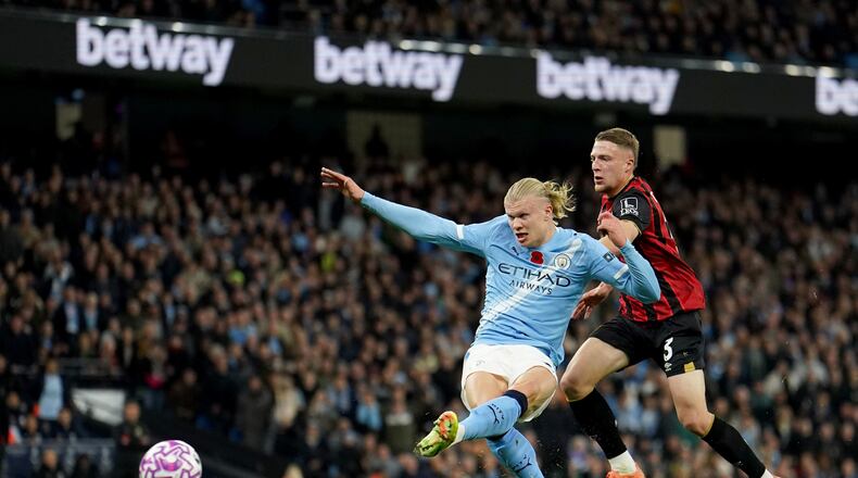 Manchester City's Erling Haaland scores his sides first goal during the English Premier League soccer match between Manchester City and Bournemouth in Manchester, England, Sunday, Nov. 2, 2025. (Martin Rickett/PA via AP)