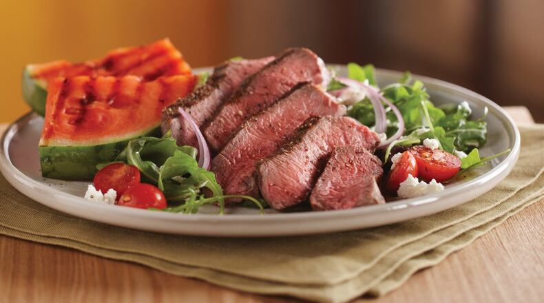 Sunday’s Grilled Steak and Watermelon Salad is paired with baked potato wedges. Contributed by The Beef Checkoff