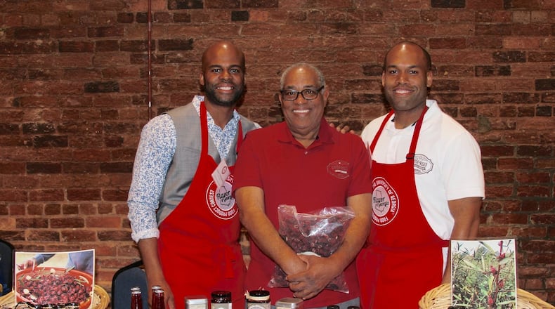 Yasin Muhaimin (center) and his sons Yasin I. Muhaimin (left) and Najeeb Muhaimin, took their Pride Road hibiscus jelly to the 2018 Flavor of Georgia competition, where it was a finalist. CONTRIBUTED BY PRIDE ROAD