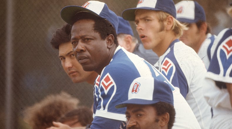 Hall of Famer Hank Aaron (center) played two decades with the Braves.