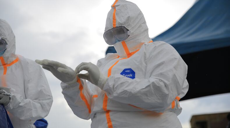 Ebola response teams organize a public demonstration to raise awareness about the Ebola virus disease in Beni, North Kivu province, eastern Congo, Tuesday, Sept. 22, 2026. (AP Photo/Sebastien Kitsa Musayi)