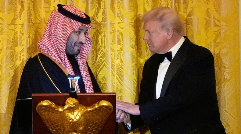 President Donald Trump shakes hands with Saudi Arabia's Crown Prince Mohammed bin Salman during a dinner in the East Room of the White House, Tuesday, Nov. 18, 2025, in Washington. (AP Photo/Alex Brandon)