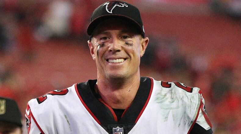 Falcons quarterback Matt Ryan is smiling while jogging off the field with a 24-21 victory over the Buccaneers in a NFL football game on Monday, December 18, 2017, in Tampa.  Curtis Compton/ccompton@ajc.com